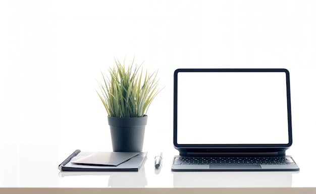 Mockup blank screen tablet on the table, isolated on white background.