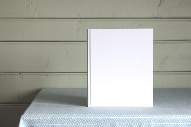 Mockup book An album with an empty white cover on the table Copy space