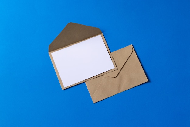 Mockup brown kraft envelope document with blank white card