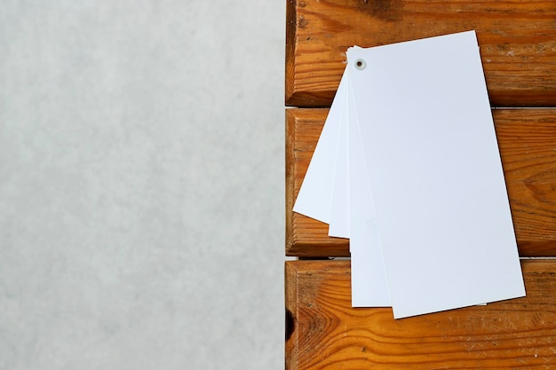 Photo mockup of business cards stack on wood table with copy space