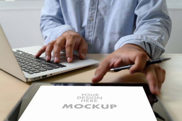 Mockup of business man using laptop screen for your advertising text message