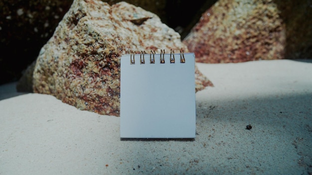 Mockup business paper card on beach sand background