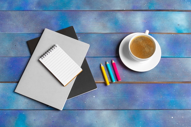 Mockup for check list, empty note paper with coffee cup on blue wood