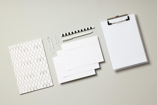 Photo mockup flat lay with different office accessories on light gray background