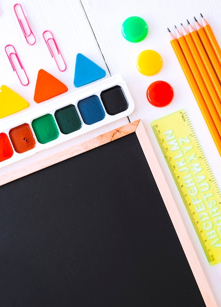 Mockup flatlay stationery chalk board on a white background of the table knolling