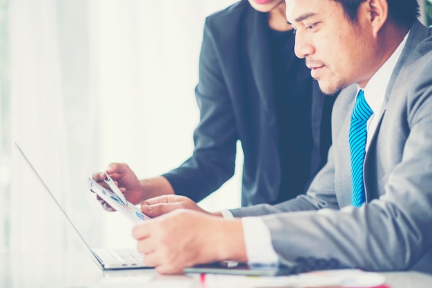 Mockup image of business using and typing on laptop