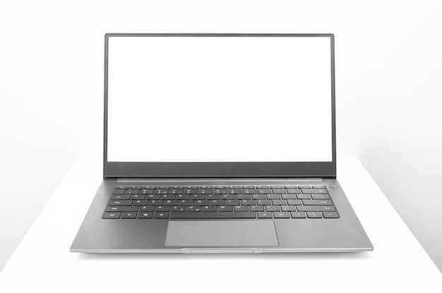 Mockup image of open laptop computer with white blank screen Laptop with blank screen on white