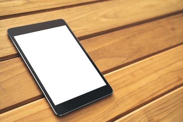 Mockup image of tablet pc on wooden table 