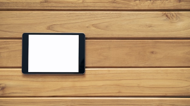 木製のテーブル上のタブレットPCの模擬イメージ