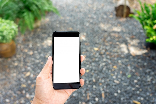 Mockup image of Woman hand holding mobile smartphones isolated white screen