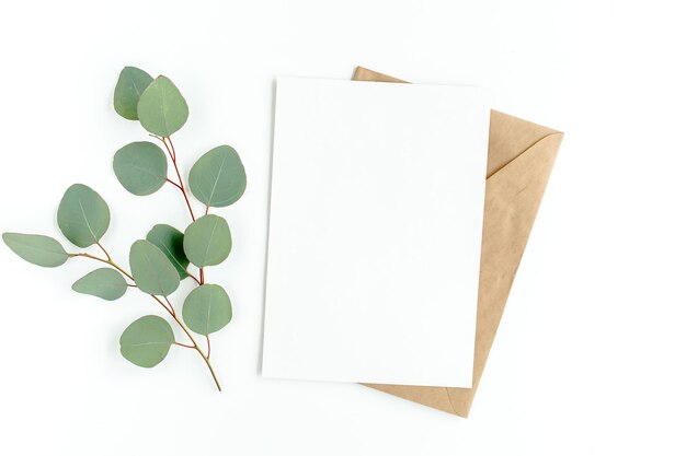 Mockup invitation blank greeting card and green leaves eucalyptus Flat lay top view