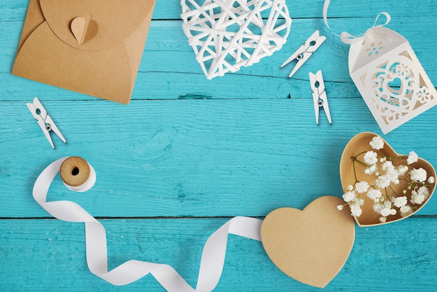 Mockup Letter with paper hearts, kraft box with flowers for greeting card St. Valentine's Day in rustic style