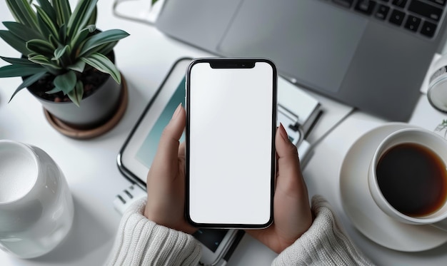 Photo mockup mobile phone female workplace with laptop and phone