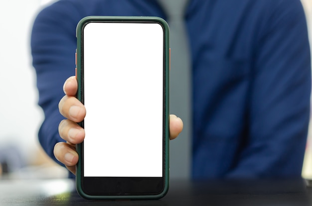 Mockup a mobile phone in the man hand. Blank screen with text or image for an advertisement.