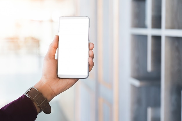 mockup mobile phone with blank screen technology and lifestyle concept.
