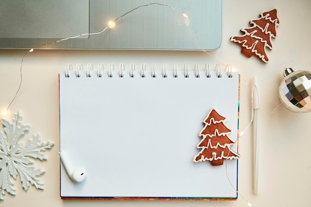 Mockup of notebook with New Years decorations and cookies