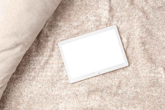 Mockup of pad or tablet computer flatlay with white screen