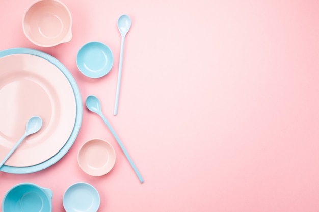 Mockup of pastel pink and blue plates and bowls over millennial pink