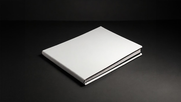 Mockup of plain white landscape hard cover book on plain black background
