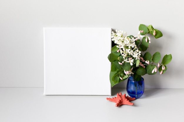 Mockup poster frame and bouquet of spring flowers