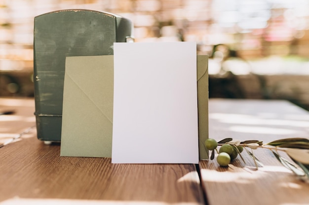 Photo mockup of a sheet of paper, an invitation to a holiday, a greeting card or a letter, against the bac