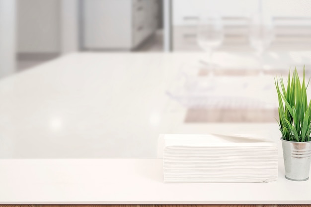 Photo mockup stack of paper towels on white table indoors with copy space