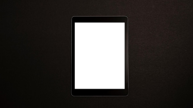 Photo mockup of a tablet on a black background wireless technology and tablet usage concept horizontal photography