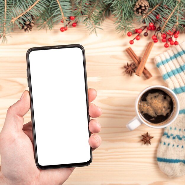 Mockup telefoon op Kerstmis achtergrond.