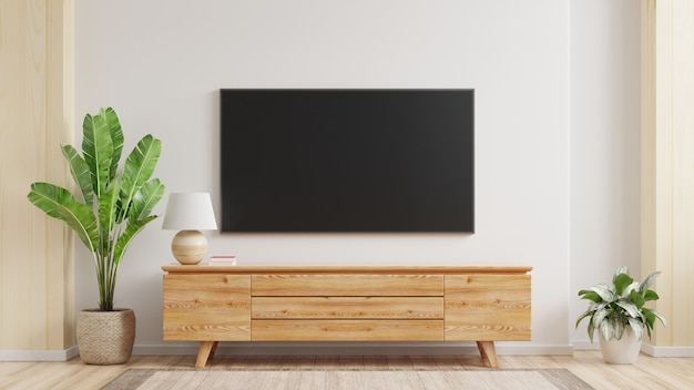Mockup di una tv montata a parete in un soggiorno con un muro bianco rendering 3d
