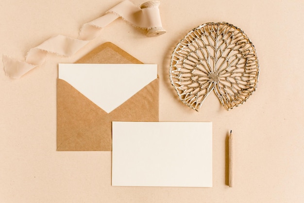 Mockup wedding invitation blank greeting card and craft envelope flat lay top view