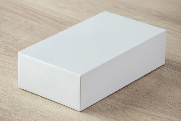 Mockup white box on wood table background