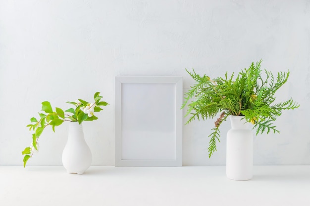 Mockup white frame and christmas branches