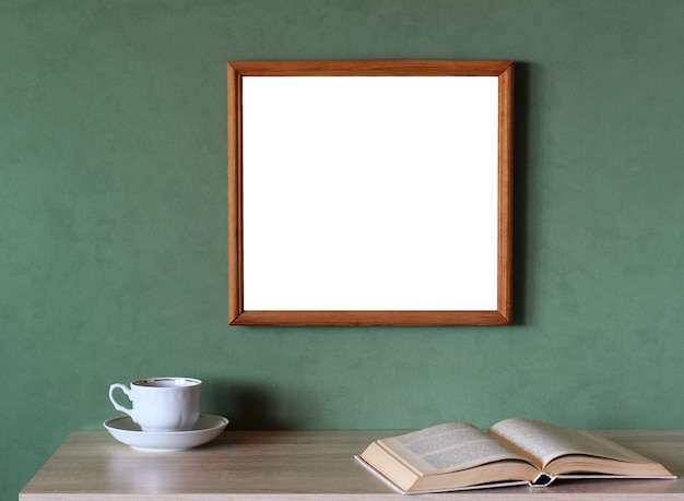 Mockup with a large empty frame on a green wall