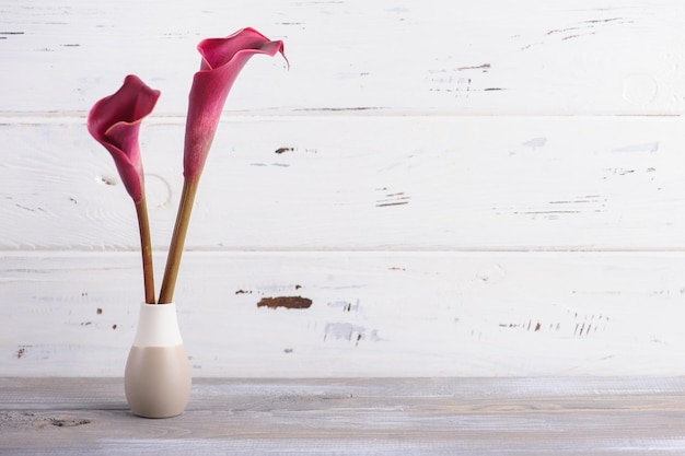 Mockup wooden background with purple calla lilly