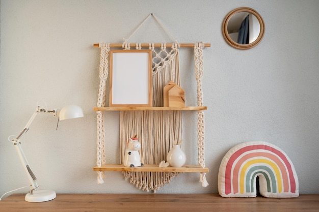 Photo mockup of a wooden frame in a modern interior beautiful macrame shelf in the room