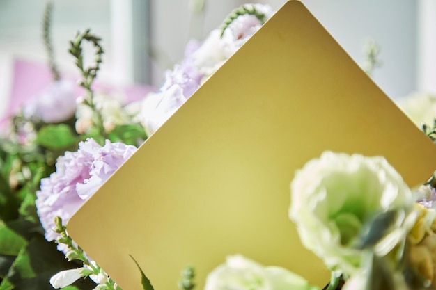 Mockup of yellow post card close up with delicate big flowers bouquet of eustoma Copy space Flowers delivery and present concept High quality photo