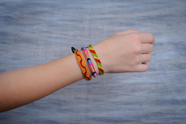 Model arm with beautiful handmade colorful bracelet