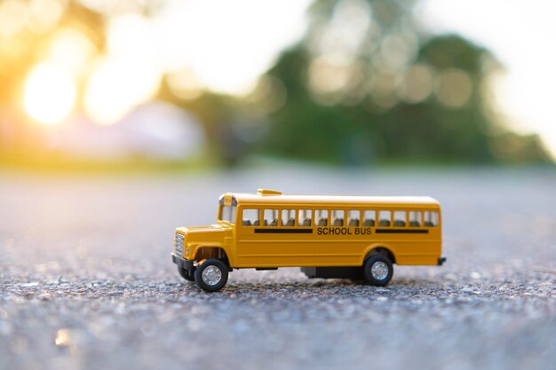 Model of classical american yellow school bus for transporting of kids to and from school every day Concept of education in the USA