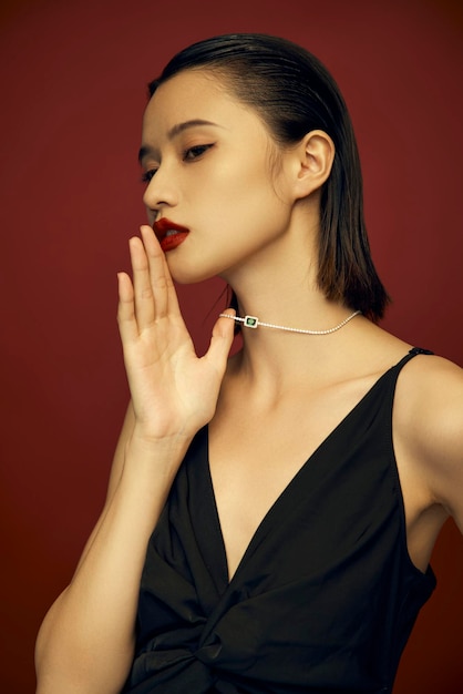 Model demonstrating earrings, pearl necklace and ring