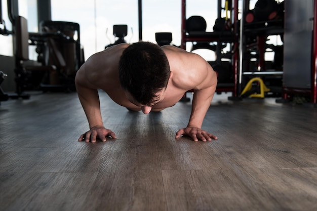 Model Doing Press Ups In Gym