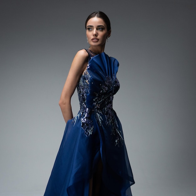 A model in an elegant evening dress dress