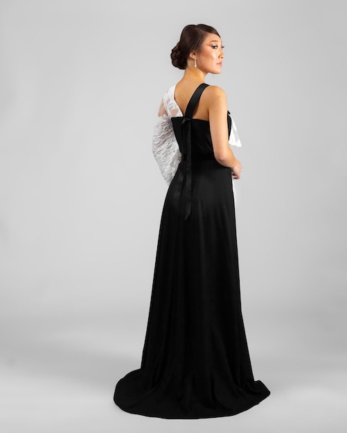 A model in an elegant evening dress dress