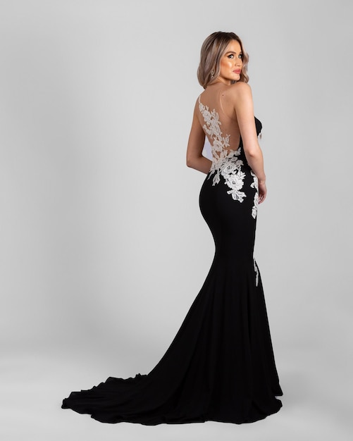 A model in an elegant evening dress dress