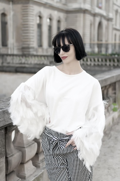 Model in fashionable clothes on street of paris france