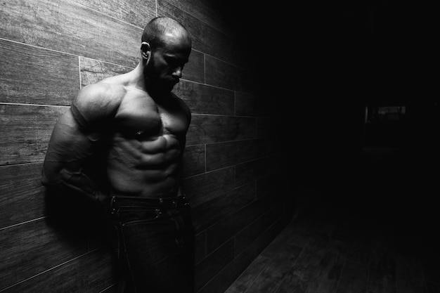 Model Flexing Muscles Against the Wall