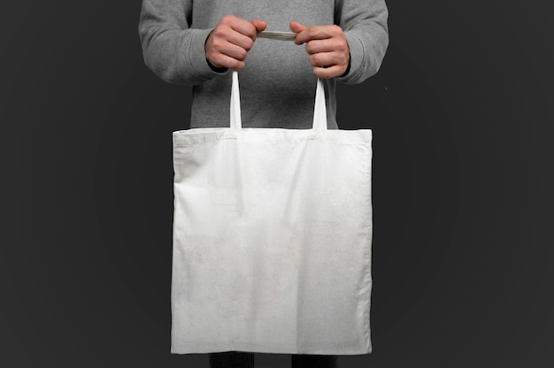 Model holding a tote bag