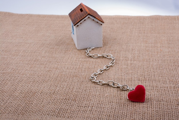 Model house and chain with a heart