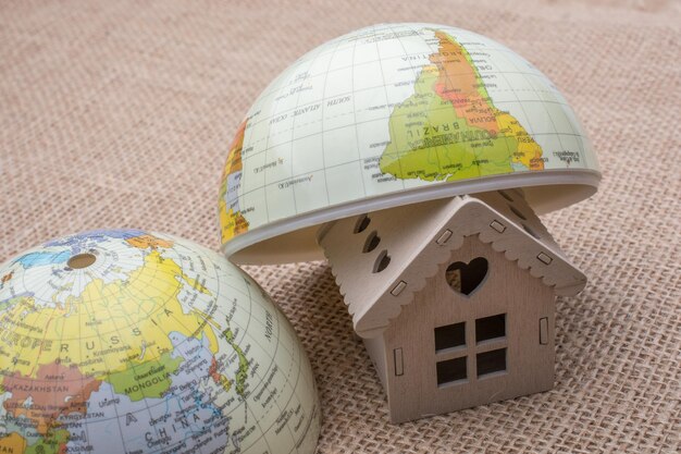 Model house and a globe on canvas