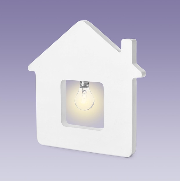 Model of house with glowing light bulb on purple background Energy efficiency loan property or business idea concepts