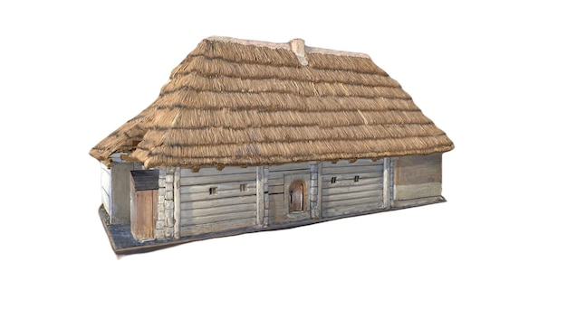 A model of a house with a thatched roof.